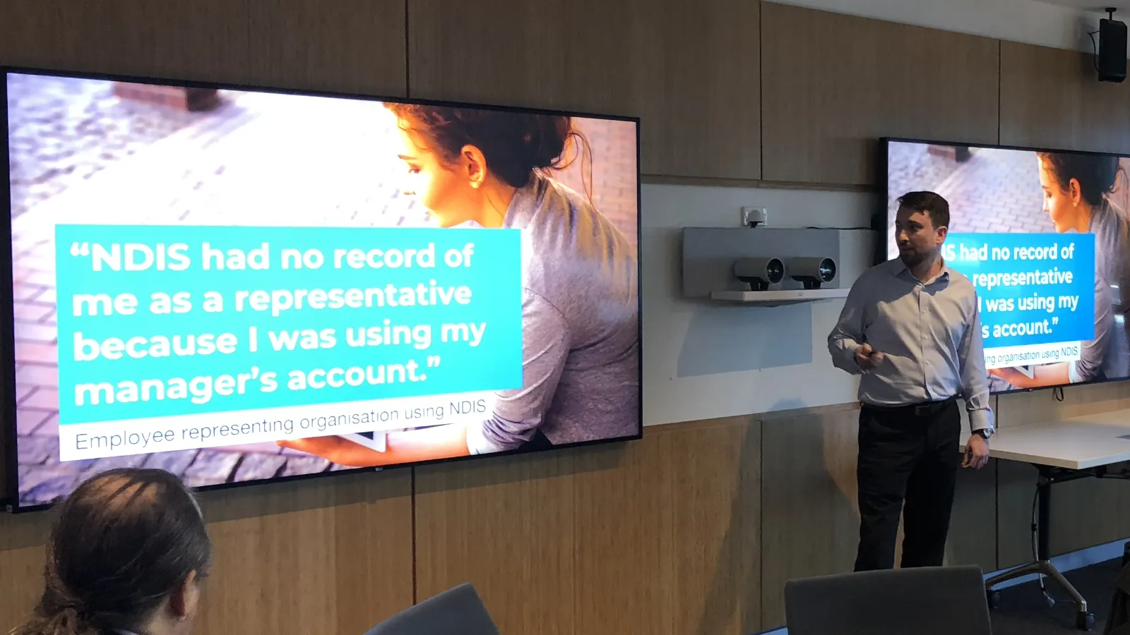 Presenting research findings to a workshop of public servants, with a participant's words on screen